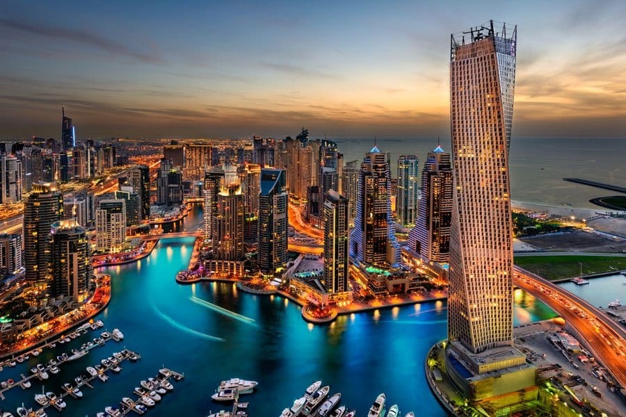 Dubai Marina skyline with waterfront towers at sunset